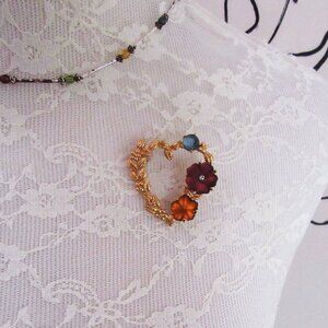 MONET vintage gold tone heart brooch with floral design and frosted flowers